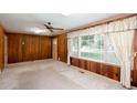 Living room showcasing a large window with curtains and carpeted floors at 4545 Gaydon Rd, Powder Springs, GA 30127