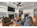 Open floor plan featuring living room with a fireplace, ceiling fan and views of the kitchen at 1258 Dekalb Ne Ave # 112, Atlanta, GA 30307