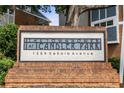 Prominent brick sign displaying 'The Townhomes at Candler Park' and the address: 1258 DeKalb Avenue at 1258 Dekalb Ne Ave # 112, Atlanta, GA 30307