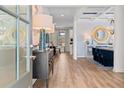 Elegant entryway featuring hardwood floors and stylish decor, leading to a dining area at 2505 Dixon Pl, Lawrenceville, GA 30045