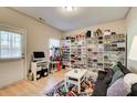 A multi purpose room with a door to the exterior, storage racks, and relaxing sofa at 3622 Utoy Dr, South Fulton, GA 30331