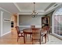 Charming dining room boasts hardwood floors, a chandelier, and lots of natural light at 1901 Paper Birch Cv, Grayson, GA 30017