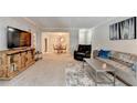Bright, open living space flowing into the dining area with stylish furnishings at 5149 Roswell Rd # 7, Atlanta, GA 30342