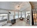 Bright sunroom with ample windows, neutral furnishings, and view of the outdoors, perfect for relaxation and enjoying the scenery at 5149 Roswell Rd # 7, Atlanta, GA 30342