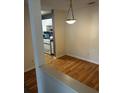 Dining area adjacent to kitchen features wood floors and natural lighting at 621 Ridge Creek Dr, Clarkston, GA 30021