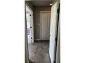 Hallway view with double doors, a closet, and purple accent wall paint at 621 Ridge Creek Dr, Clarkston, GA 30021