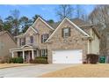 Beautiful two-story home featuring brick and siding, a two-car garage, and well-maintained landscaping at 1070 Cureton Dr, Austell, GA 30106