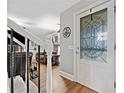 Inviting foyer features hardwood floors, a decorative glass front door and entry to living room at 2545 Hickory Level Rd, Villa Rica, GA 30180