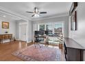 Bright home office with large windows, hardwood floors, and a ceiling fan at 3400 Dencrest Se Ct, Smyrna, GA 30080