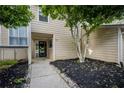 Inviting exterior of home featuring tidy landscaping and covered entryway at 1924 Variations Ne Dr, Atlanta, GA 30329