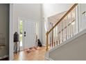 Bright foyer features tile flooring, stairs and classic entry door at 140 Melrose Creek Dr, Stockbridge, GA 30281