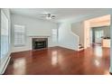 Bright living room featuring a fireplace, hardwood floors, and ample natural light at 1331 Memorial Se Dr, Atlanta, GA 30317