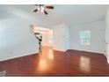 Inviting living room with hardwood floors and an open floorplan to the dining area and kitchen at 1331 Memorial Se Dr, Atlanta, GA 30317