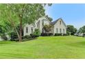 Stunning two-story home with lush landscaping, and pristine curb appeal at 1595 Chadberry Way, Lawrenceville, GA 30043