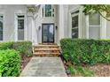 Elegant front entrance with stone steps and decorative glass doors at 1595 Chadberry Way, Lawrenceville, GA 30043
