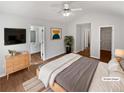 Comfortable bedroom with vaulted ceiling, ceiling fan, and en suite bathroom access at 3968 Oak Glenn Dr, Duluth, GA 30096