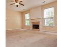 Spacious living room featuring a fireplace and large windows at 136 Parkstone Way, Marietta, GA 30066