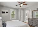 Cozy bedroom with a ceiling fan, natural light, and stylish furnishings at 5074 Park Ave, Forest Park, GA 30297