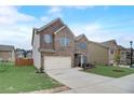 Two-story brick home with an attached two-car garage and lovely lawn at 1173 Gaines St, Jonesboro, GA 30238