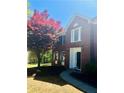 Close up of a red brick home, showcasing the front entrance at 415 Wood Trace Ct, Alpharetta, GA 30022