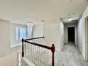 Upstairs hallway features a decorative chandelier and carpet at 415 Wood Trace Ct, Alpharetta, GA 30022