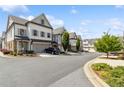 Street view of townhomes featuring manicured landscaping and a welcoming neighborhood setting at 1241 Hightower Nw Xing, Marietta, GA 30060