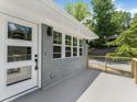 Stylish front porch with gray brick, modern railings, and a bright front door, offering a welcoming entrance at 1603 Ezra Church Nw Dr, Atlanta, GA 30314