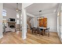 Spacious open-concept living and dining area with hardwood floors and plenty of natural light at 5440 Old Haven Ct, Cumming, GA 30041