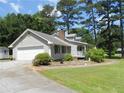 Single-story home with attached garage, side yard, and traditional design at 6 Fairfield Dr, Ellenwood, GA 30294