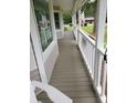 Cozy front porch with painted wood flooring and railing, perfect for relaxing and enjoying the outdoors at 6 Fairfield Dr, Ellenwood, GA 30294