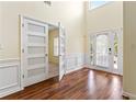 Bright foyer with hardwood floors, high ceilings, and modern doors at 507 Vaughan Dr, Hampton, GA 30228