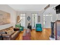 Bright and airy living room with hardwood floors, ample natural light, and tasteful decor at 1274 Cotton Gin Dr, Powder Springs, GA 30127