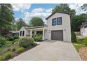 A bright, two-story home features a convenient attached garage and manicured landscaping at 1815 Coventry Rd, Decatur, GA 30030