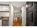 Inviting entryway with hardwood floors leads to a cozy living area and updated kitchen with granite countertops at 3655 Habersham Ne Rd # 203, Atlanta, GA 30305