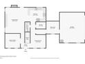 Floor plan highlighting the kitchen, living room, and bonus room layouts on the first floor at 615 Henderson Mill Rd, Covington, GA 30014
