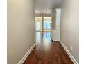 Inviting entryway featuring hardwood floors and convenient built-in shelving for a warm welcome at 2141 Spikerush Way, Buford, GA 30519