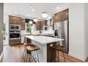 Modern kitchen features stainless steel appliances, a large island with seating, and sleek cabinetry at 2535 Astaire Ct, Atlanta, GA 30318