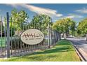 Attractive Avalon at Sandy Springs neighborhood entrance sign with brick columns and manicured lawn at 105 North River Dr # A, Atlanta, GA 30350