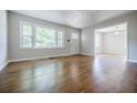 Bright living room featuring hardwood floors, large windows offering lots of natural light at 1716 Beacon Hill Ne Blvd, Atlanta, GA 30329