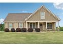 Charming single-story home with a welcoming front porch and well-manicured lawn at 625 Henderson Mill Rd, Covington, GA 30014