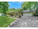 A well maintained home with a driveway leading to an attached two-car garage at 1605 Saddlecreek Rd, Auburn, GA 30011