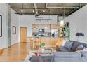 Contemporary kitchen featuring light wood cabinets, stainless steel appliances, and a breakfast bar with seating at 3235 Roswell Ne Rd # 702, Atlanta, GA 30305