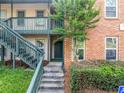 Building exterior with stairwell and natural landscaping at 705 Beaufort Cir, Duluth, GA 30096