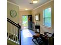 Inviting foyer with hardwood floors, leading to a sunlit view and stylish interior accents at 201 Jonquil Spring Rd, Woodstock, GA 30188