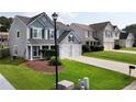 Attractive two-story home features a well-maintained lawn and a convenient two-car garage at 3200 Binghampton Ln, Lawrenceville, GA 30044