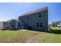 The backyard features a new patio, ample green space, and tidy landscaping at 5440 Wheeler Ridge Rd, Auburn, GA 30011