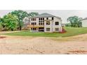 A view of the back of the house with new grass installed showing the deck at 3065 Reserve Ct Sw, Conyers, GA 30094