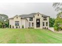 Stunning two-story home with a well-manicured lawn and elegant brick facade at 3065 Reserve Ct Sw, Conyers, GA 30094