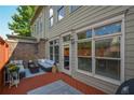 Relaxing back porch featuring comfortable outdoor seating and a view of the surrounding landscape at 661 Lockton Pl, Sandy Springs, GA 30342