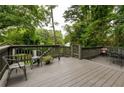 Spacious wooden deck providing an outdoor seating area surrounded by lush greenery at 1682 Grace Se St, Atlanta, GA 30316